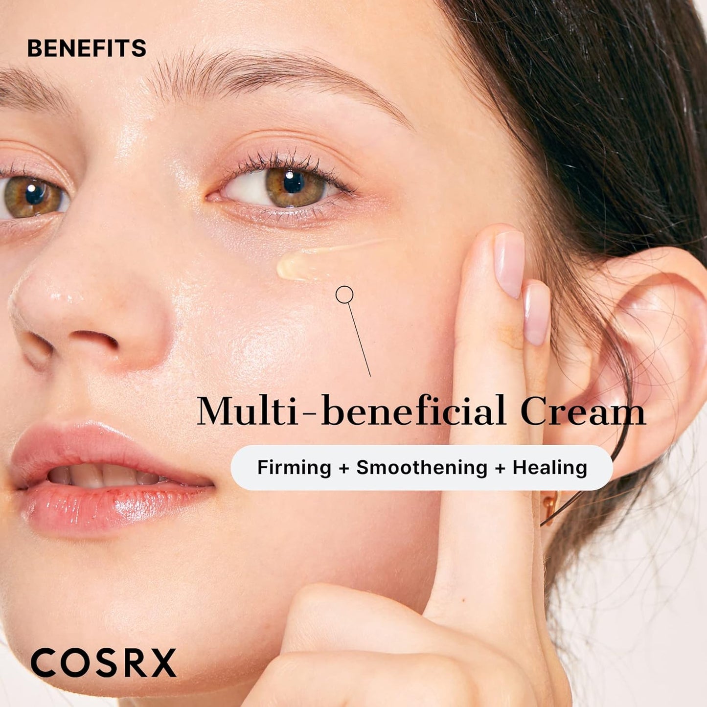 Woman applying COSRX The Retinol 0.1 cream to her face.